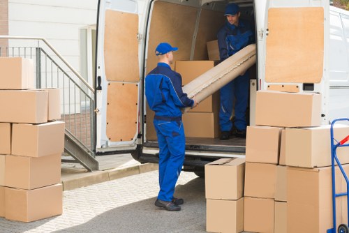 Unpacking services helping a family settle into a Holland Park property