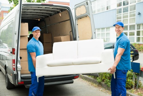 Removal team planning a flat move near Holland Park apartment buildings