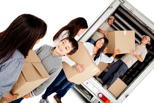 Packing boxes and protective materials prepared for a move in Holland Park