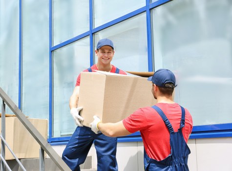 Removal team planning a move in Holland Park residential street