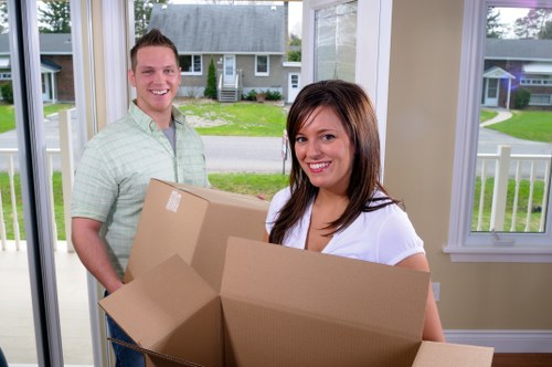 Packed household items ready for collection during a Holland Park flat relocation