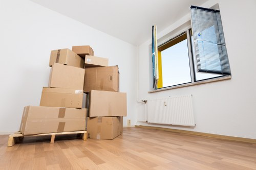 Removal van loading outside a residential building in Holland Park