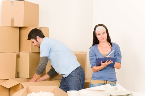 Packing fragile household items for a move around Holland Park