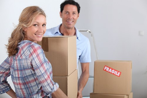 Careful loading of boxes and furniture for a Holland Park relocation
