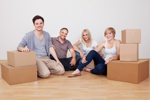 Careful handling of household items during a flat move in Holland Park